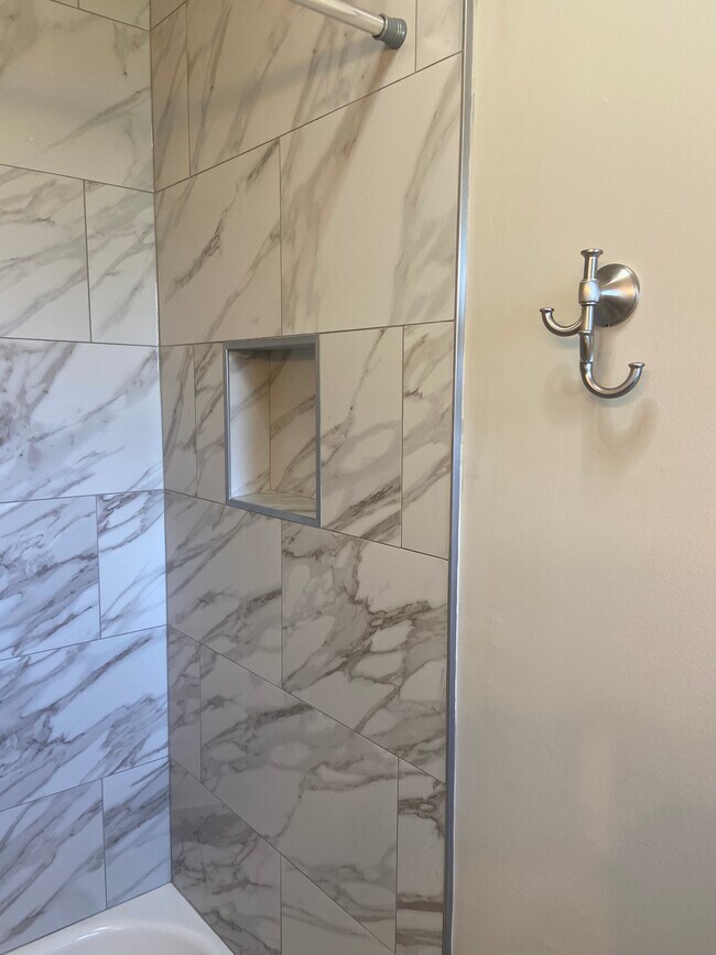 Owners' Suite en-suite bathroom with new vanity, toilet, lights, blue tooth exhaust fan, and storage - 174 Brisbane Ave