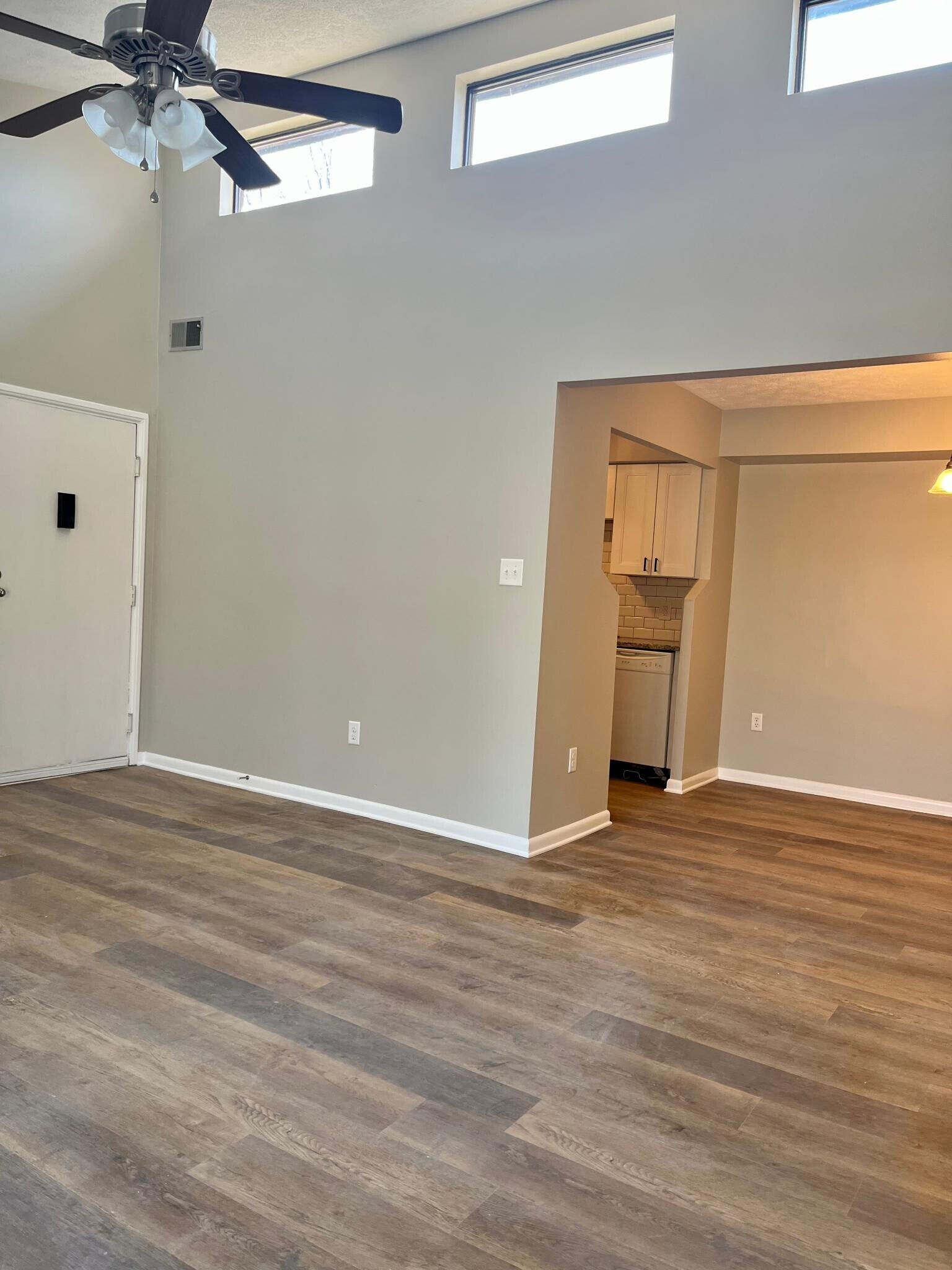 Living room looking into dining room and kitchen - 104 Turtle Creek Rd