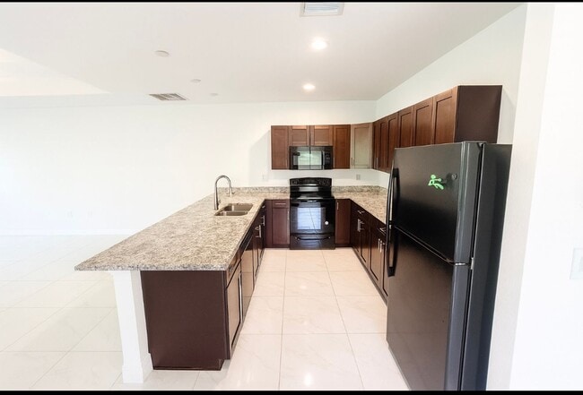 Building Photo - MUST SEE -2/2/1+OPEN DEN-DUPLEX IN GREENBR...