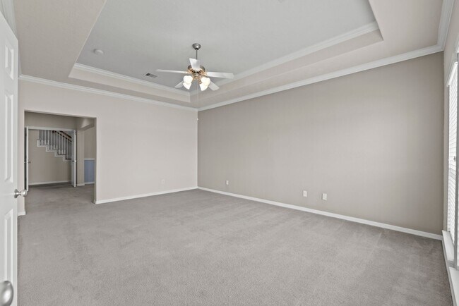 Building Photo - Luxury Townhome with Attached Garage & Outdoor Entertaining Area - $100 off first and second mont!