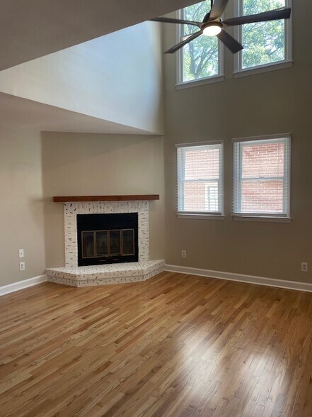 Spacious living space with updated fireplace and vaulted ceilings. - 815 Lexington Ave