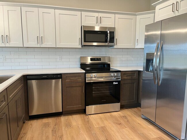 Building Photo - Spacious 5-Bedroom Duplex Near Asbury Elementary with Finished Basement & Full Amenities