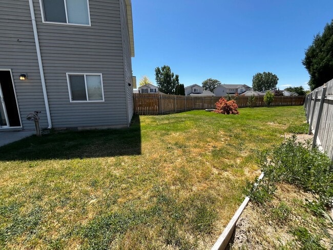Building Photo - 4 Bedroom Home with Bonus Room Potential & RV Parking!