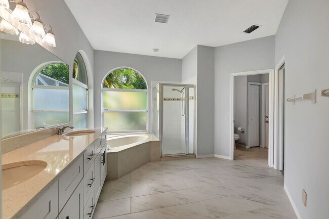 Building Photo - A BOATER'S PARADISE WITH THIS STUNNING 3 BEDROOM, 2 BATH WATERFRONT POOL HOME W/DOCK & BOAT LIFT ...