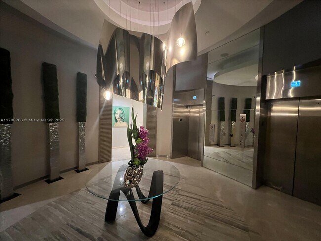 Building Photo - 10275 Collins Ave