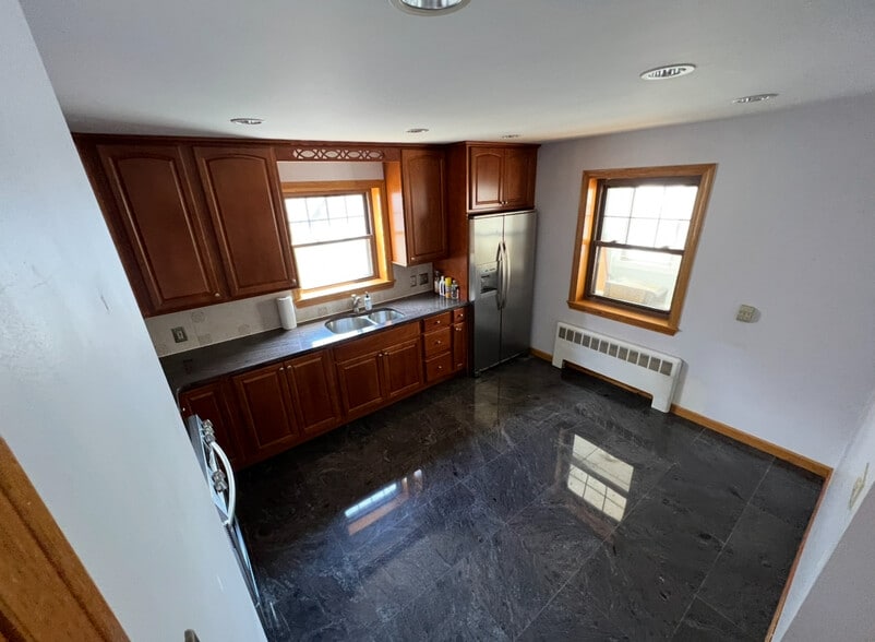 Eat In Kitchen with Modern Appliances and granite countertops. - 202 Orient Ave