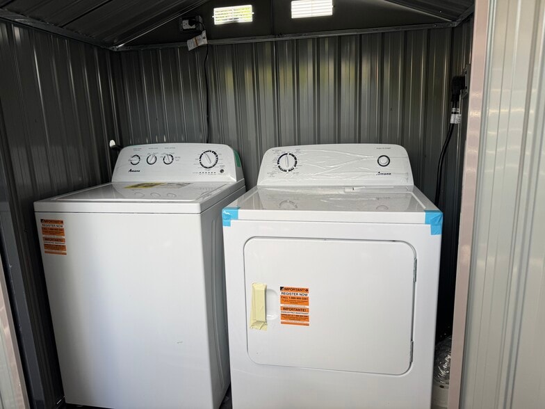 Washer and dryer on patio - 1214 NE 5th Ter