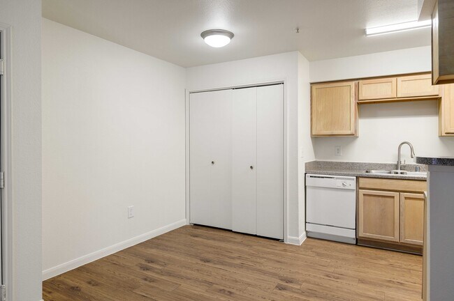 B1 Entry, Dining Room, Utility Closet, and Kitchen - Memorial Heights at Washington