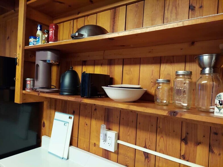 Kitchen detail: coffee maker, tea kettle, dishes, starter condiments - 311 Newton Aly