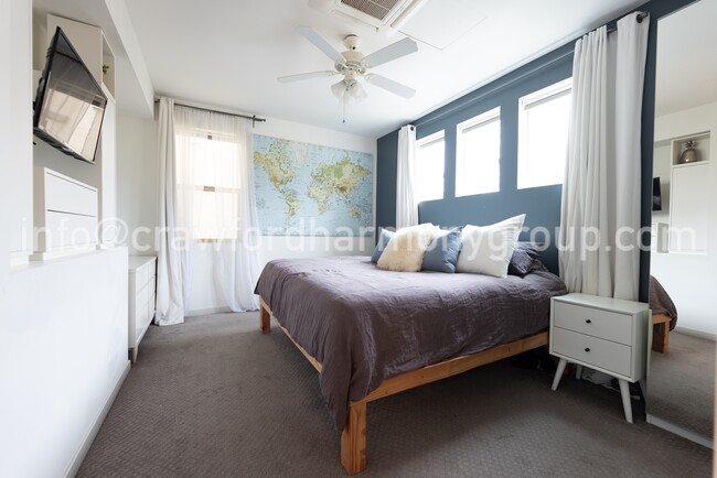 Light-filled and spacious primary bedroom can easily accommodate a king size bed. - 459 Lug Ln