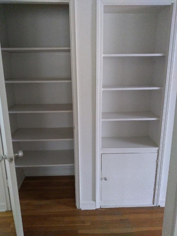 Built-in shelves and closet with shelves in hallway upstairs - 107 Chestnut St