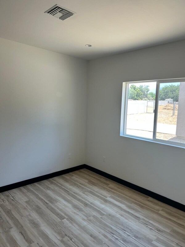 Building Photo - 9208 E Ave T 6