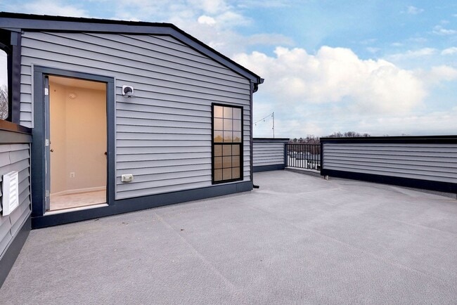 Building Photo - Three Story Brick End Unit with Rooftop Terrace