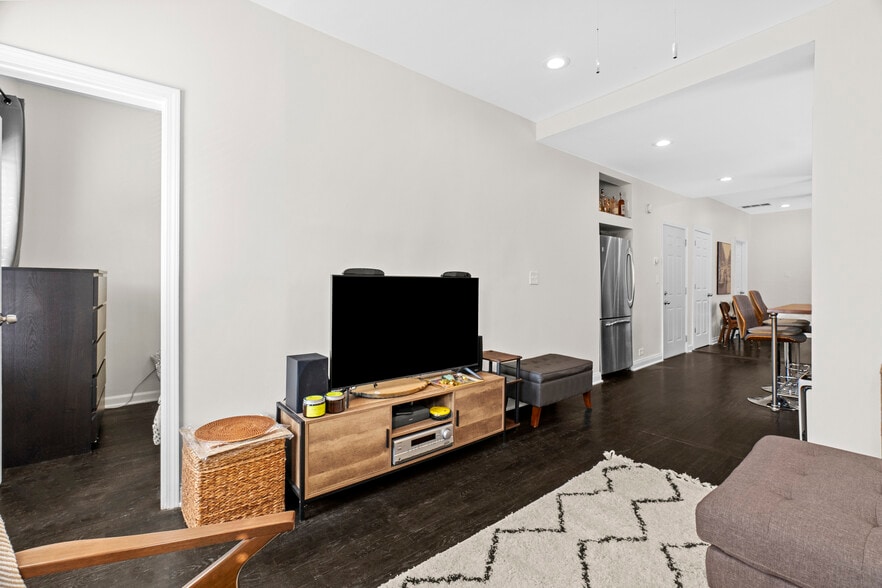 Living room, open to kitchen. - 2338 W 18th Pl