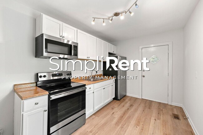 Building Photo - PRICE REDUCED! 1st month's Rent FREE with a 13-month lease!