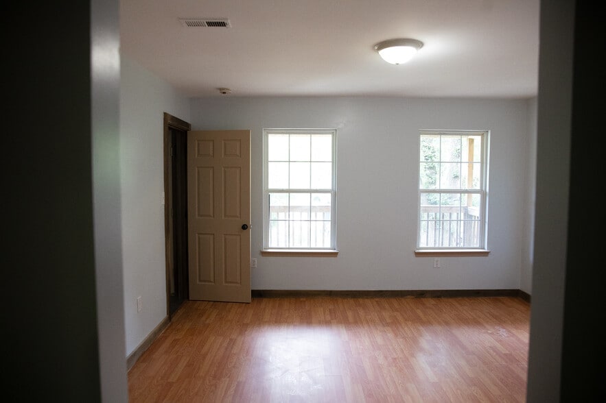 Primary bedroom looks out onto porch and front yard - 16 Townview Dr