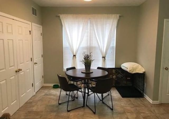 Well lit eat-in kitchen with laundry to the left. - 231 Legacy Lane