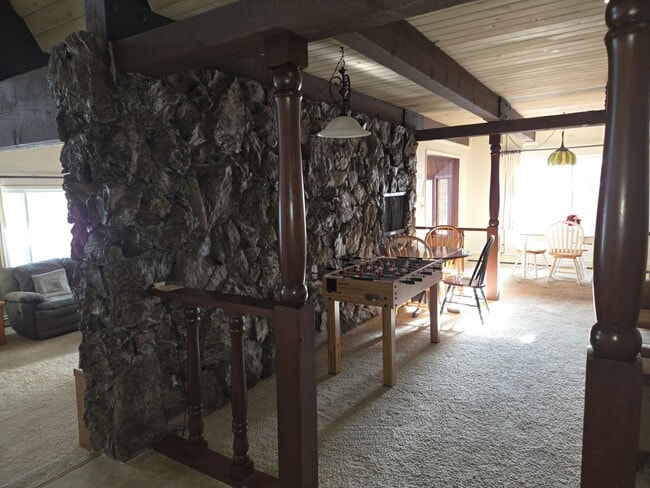 Building Photo - Unique open design,wood beams in all rooms-Very cheery and cozy. Newly remodeled, and newly furni...