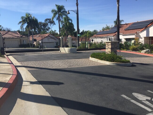 Gate into subdivision - 15928 Caminito Aire Puro