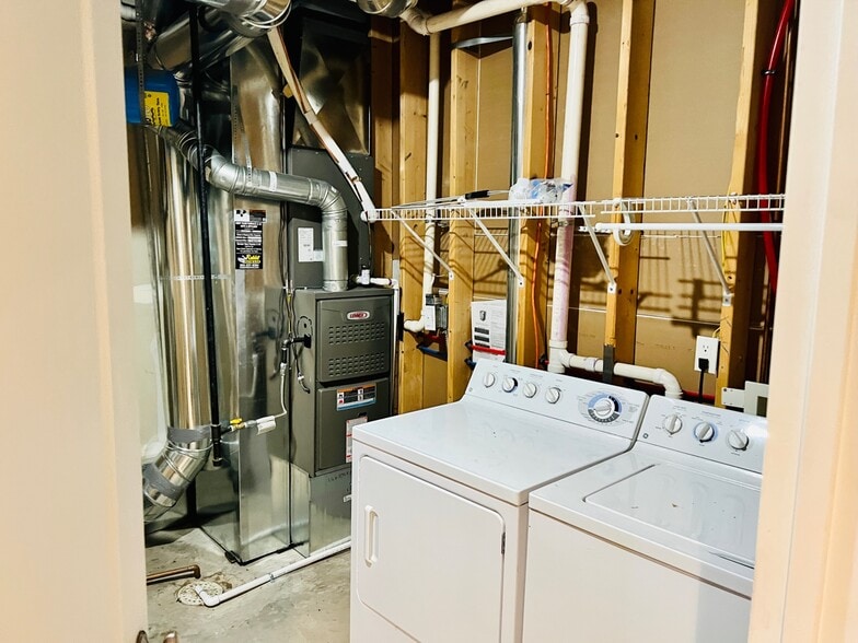 In unit washer & dryer. There is extra storage space behind the door. - 2317 Decatur St