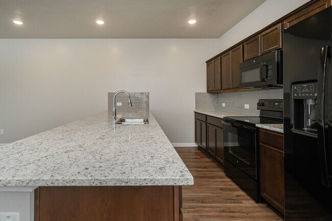 Building Photo - Live, love, and grow in this charming townhome!