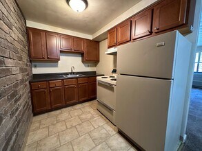 Building Photo - One Bedroom Apartment with Exposed Brick & Off-Street Parking! Tour this Stunning One Bedroom Today!