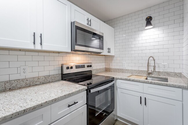 Building Photo - Discover Modern Living at Genesis Apartmen...