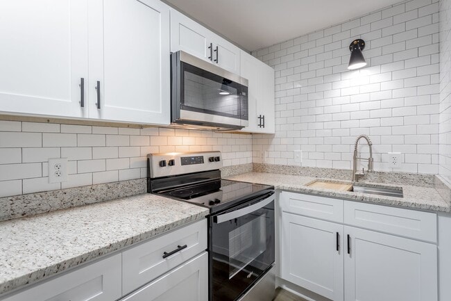 Building Photo - Discover Modern Living at Genesis Apartments