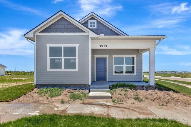 Primary Photo - Modern 3-Bed Ranch in Maize – Zero-Entry L...