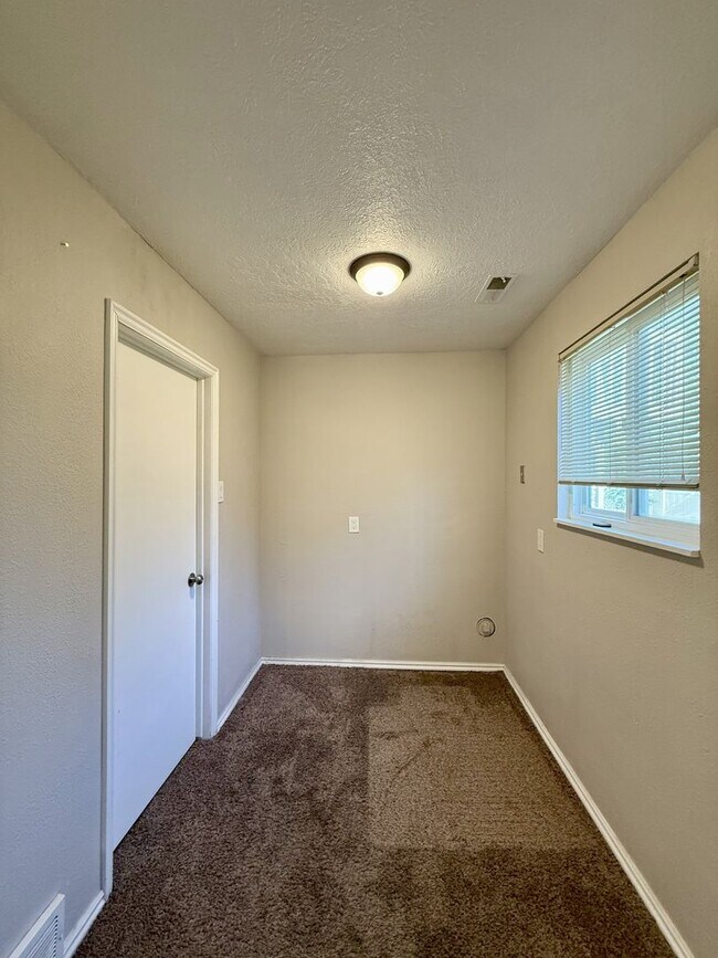 Building Photo - Spacious Comfort Meets Practical Living in...