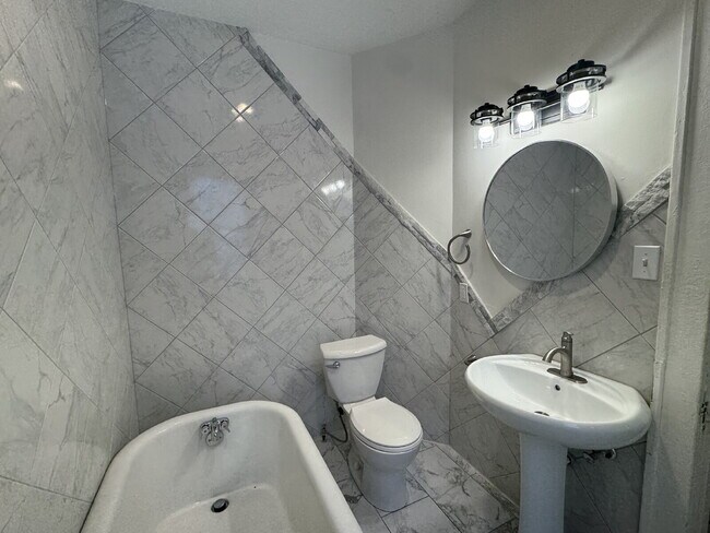 Building Photo - "Spacious 3-Bedroom Minneapolis Gem with Gleaming Hardwood Floors & 2 Full Baths!"