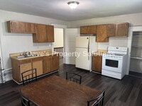 Building Photo - Move-In Ready Upstairs Unit | New Flooring, Eat-In Kitchen & Tons of Closets