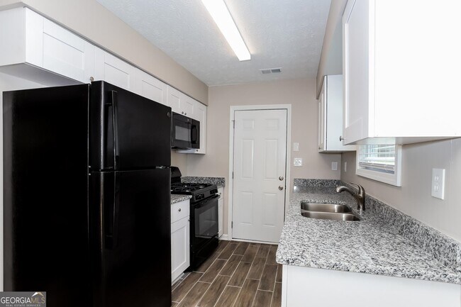 Building Photo - 9073 Woodgreen Way