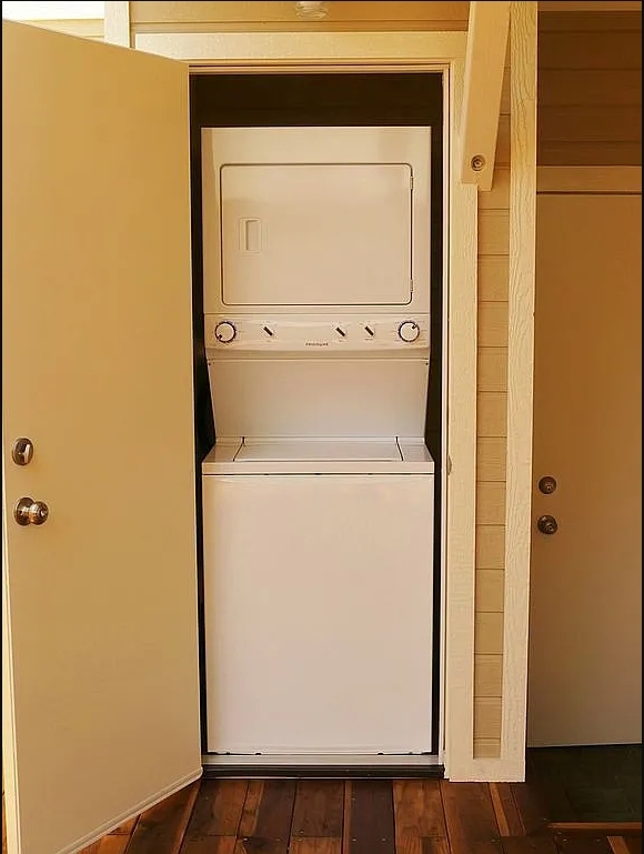 stacked washer/dryer on deck. door on right goes into garage - 319 W Chevy Chase Dr