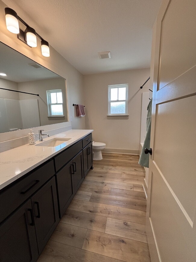 Building Photo - Need Space?  How about 5 bedrooms, 2.5 baths + an extra bonus area upstairs so that the kids can ...