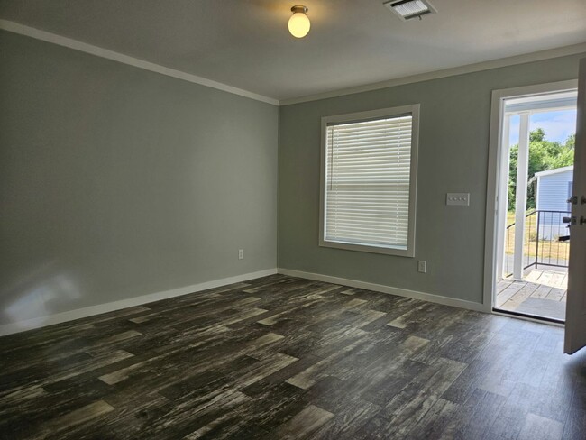 Building Photo - 6691 Hidden Oaks Dr