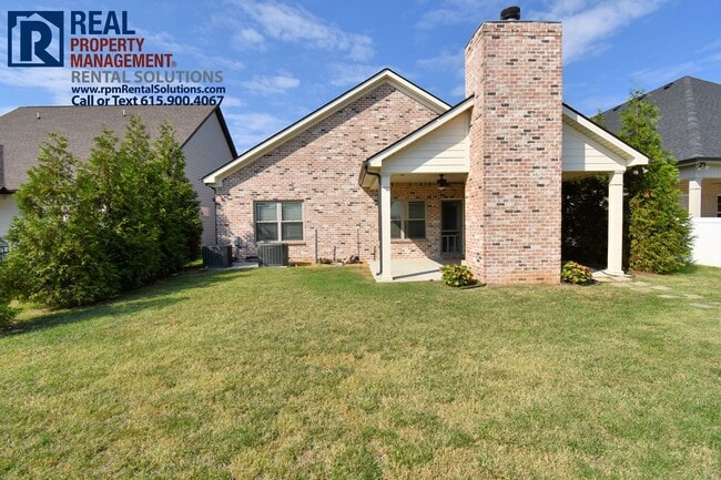 Building Photo - All brick 4 bedroom home plus Bonus room! Garage and covered patio!