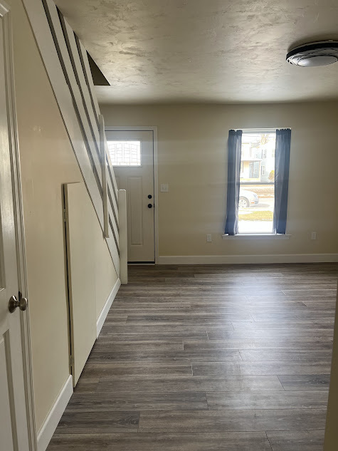 Living room looking toward the front door - 122 3rd St