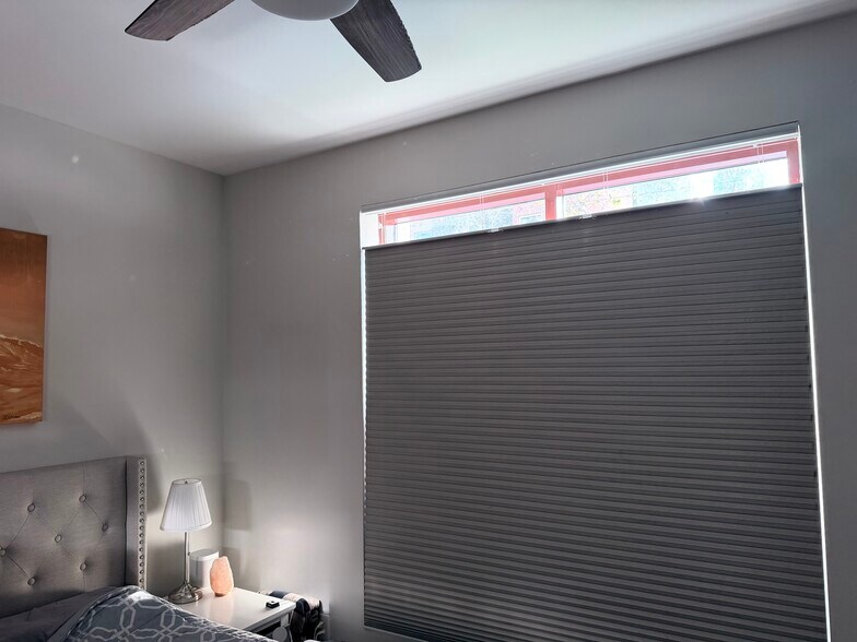 Custom versatile blackout blinds in second bedroom - 1150 J St