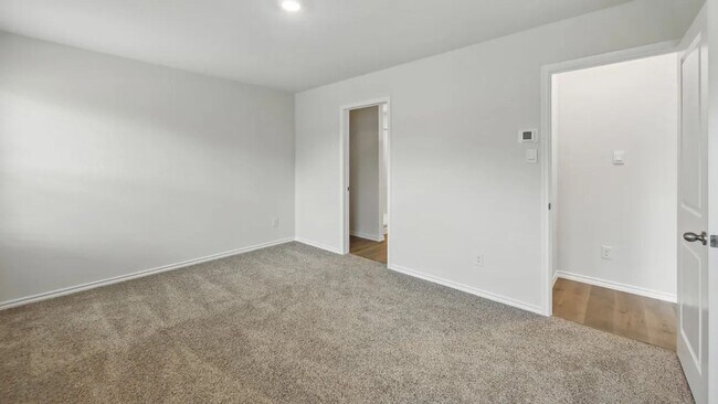 Building Photo - Beautiful new 4-bedroom, 2-bath home with an open floor plan, granite kitchen, two-car garage, an...