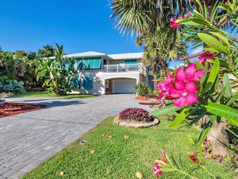 Front of house with 2 car garage - 6710 S Highway A1A