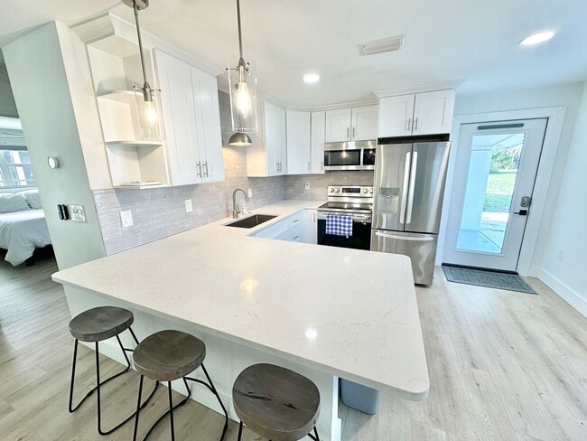 Building Photo - ** BONITA SPRINGS ** 3 BED / 1 BATH - SINGLE FAMILY HOME - NO HOA! - WATERFRONT LOT - ANNUAL RENTAL