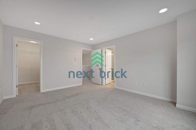 Building Photo - A Beautiful Corner Home Designed for Comfort, Light & Community!