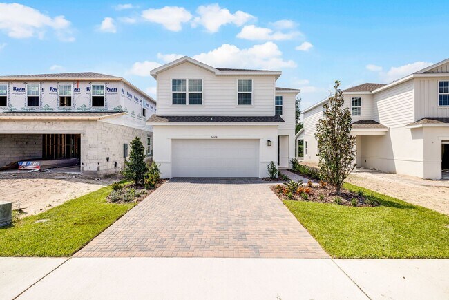 Building Photo - Brand-New 4BR Home with Tile Floors & Quar...