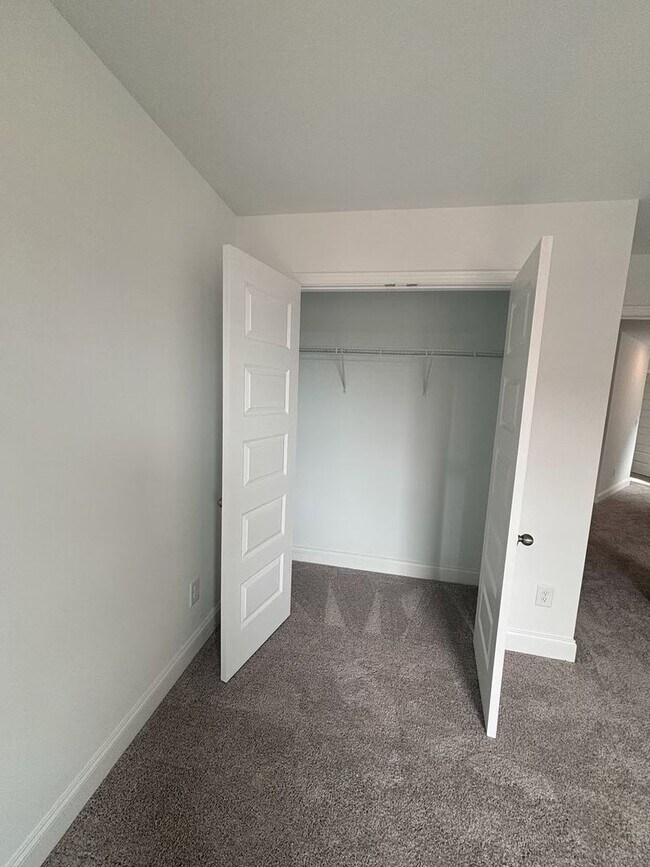Building Photo - **BE THE LUCKY ONE TO LIVE IN THIS 2024-BUILT END-UNIT TOWNHOME IN A RESORT-STYLE COMMUNITY**