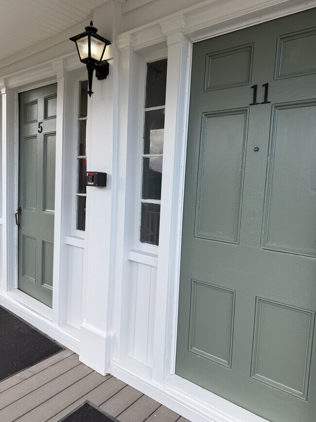 Freshly painted entrances to apartment community - 5 Chapel St
