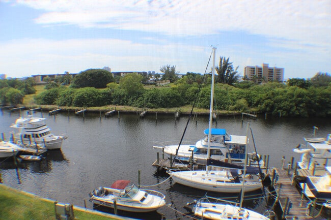 Building Photo - 2/2 Condo with Marina and River Views-Includes cable and water