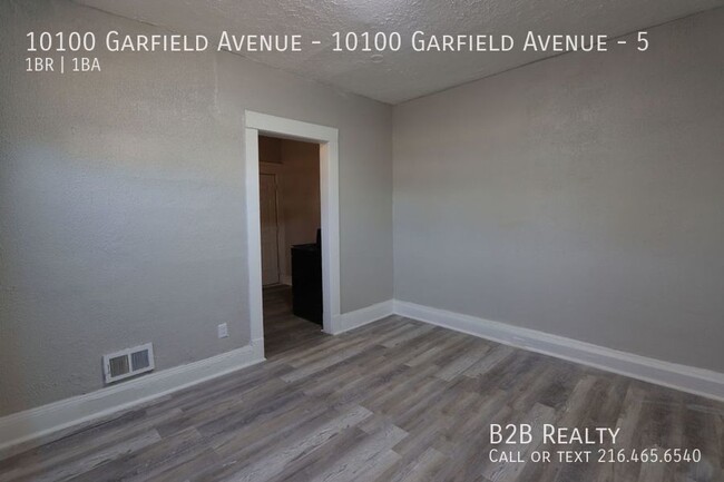 Building Photo - "Charming 1-Bedroom Oasis: Your Perfect Bl...