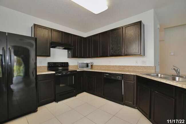 Building Photo - Spacious 3/2.5 Townhome with a 2 Car Garage and a Beautiful Pond View in Westwood Condos - Orlando!