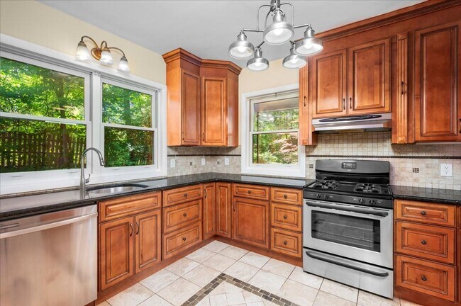 Building Photo - Elegant Multi-Level Brick Residence with Outdoor Oasis